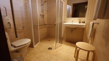 Designer toiletries, hair dryer, towels