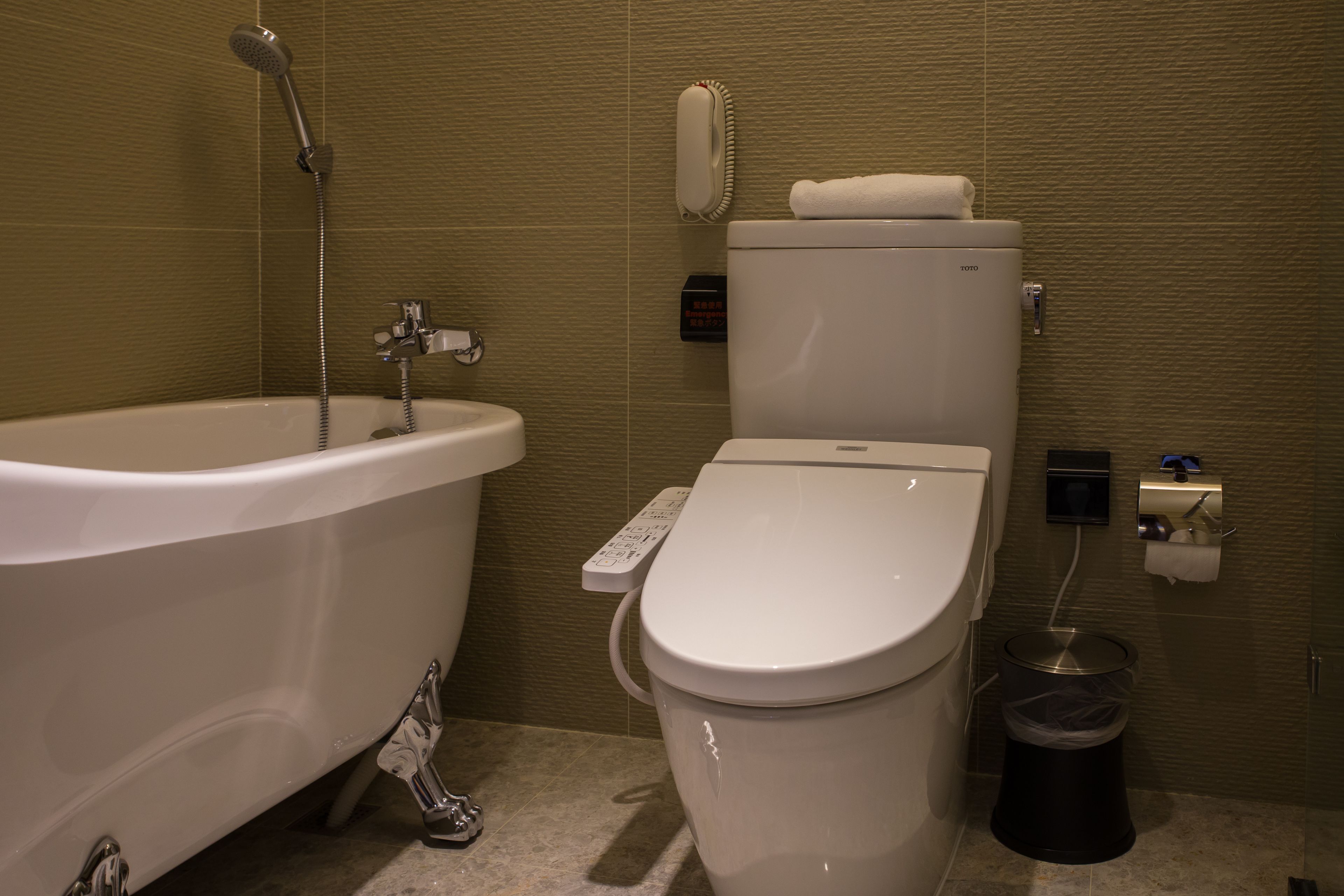 premium room | bathroom | eco-friendly toiletries, hair dryer, slippers, towels