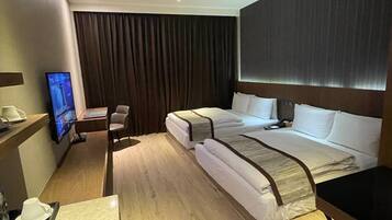 Standard Quadruple Room, City View | Down comforters, in-room safe, desk, laptop workspace