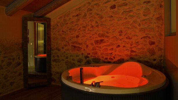 A stone-walled bathroom with a freestanding bathtub. - Elia Kentron- Adults Only (Chania)