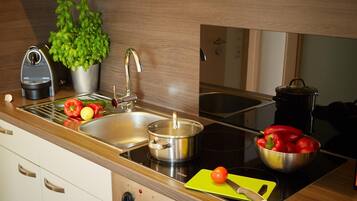 Fridge, microwave, stovetop, coffee/tea maker