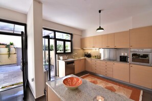Villa | Private kitchen | Fridge, microwave, oven, stovetop