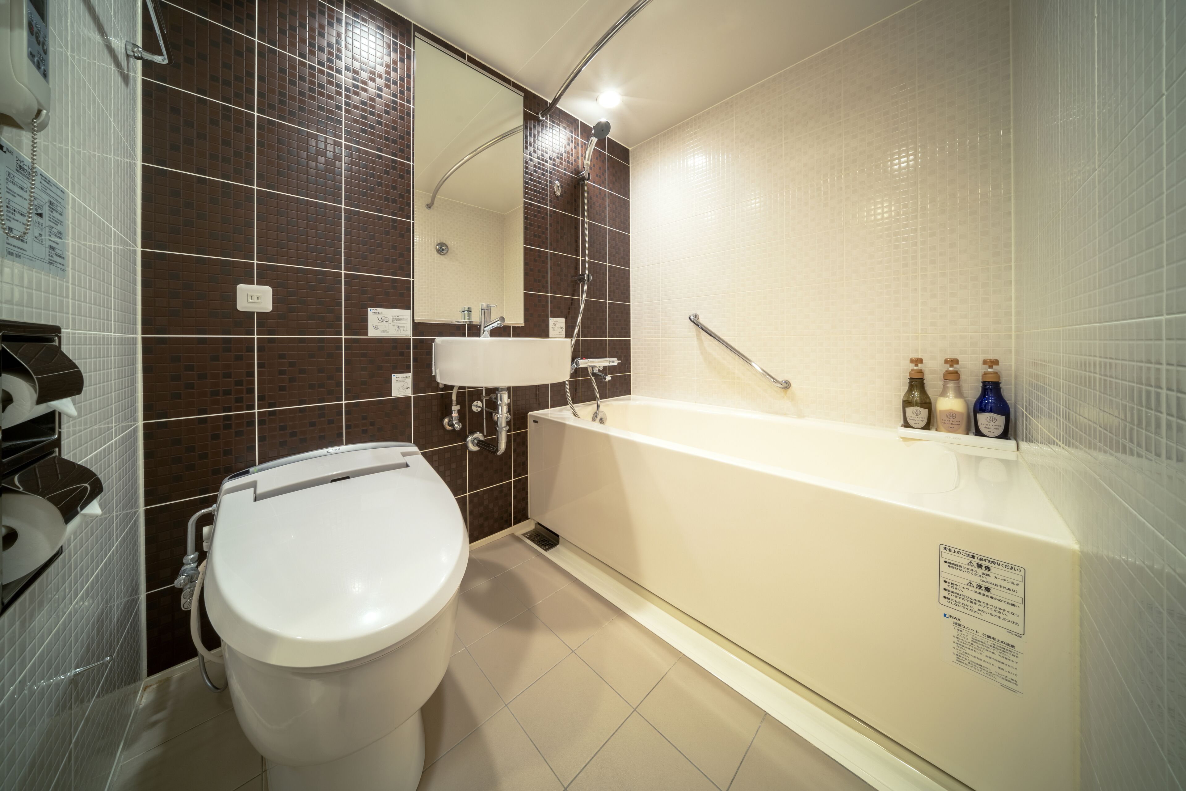 combined shower/bathtub, free toiletries, hair dryer, slippers