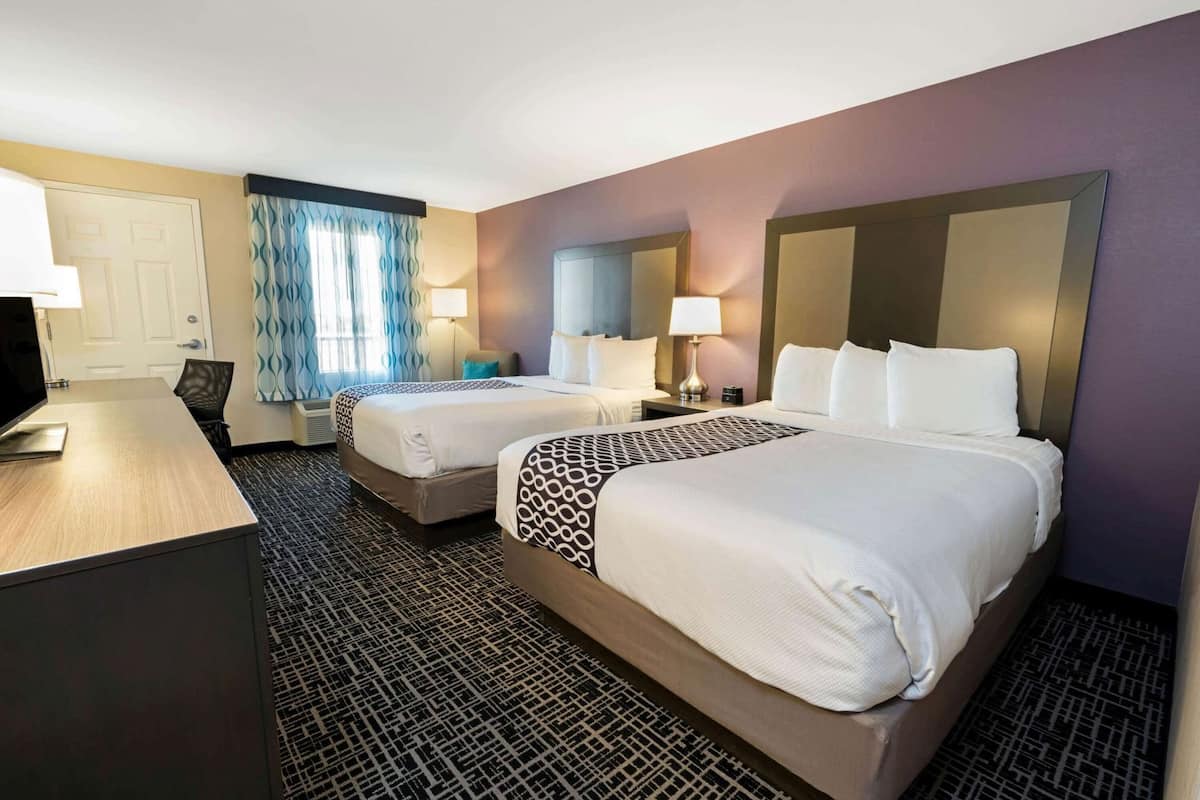 Premium bedding, pillow-top beds, desk, blackout curtains