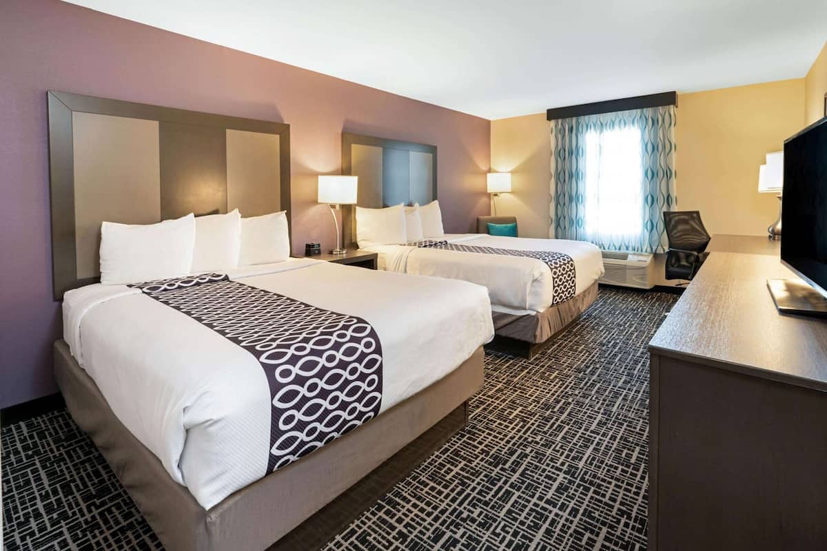 Premium bedding, pillow-top beds, desk, blackout curtains