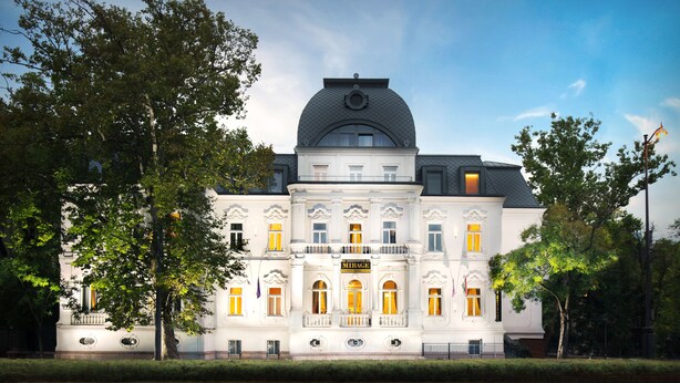 A historic building with a central dome, symmetrical facade, and multiple windows. - Mirage Medic Hotel (Budapest)