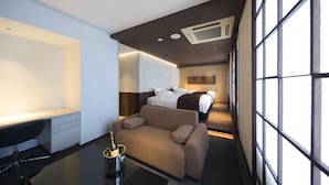 A modern hotel room with a large bed, a sofa, a desk, and a large window. - HOTEL THE Grandee Shinsaibashi Namba (Osaka)