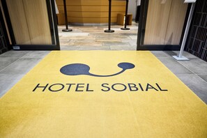 A hotel entrance with a yellow carpet and the words "HOTEL SOBIAL" visible. - Hotel Sobial Osaka Dome (Osaka)