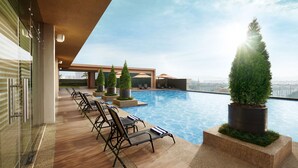 A rooftop pool area with lounge chairs and potted plants. - Sunway Lagoon Hotel (formerly Sunway Clio Hotel) (Petaling Jaya)