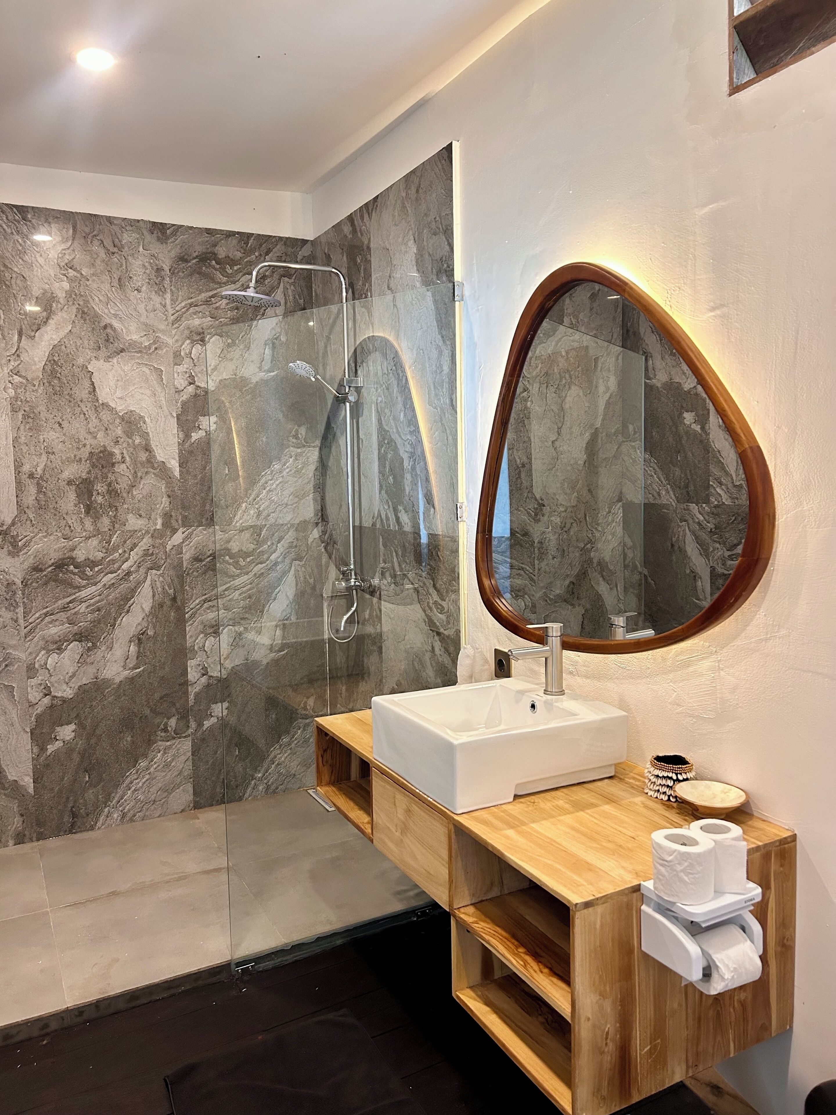 deluxe bungalow | bathroom | shower, hair dryer, towels, soap