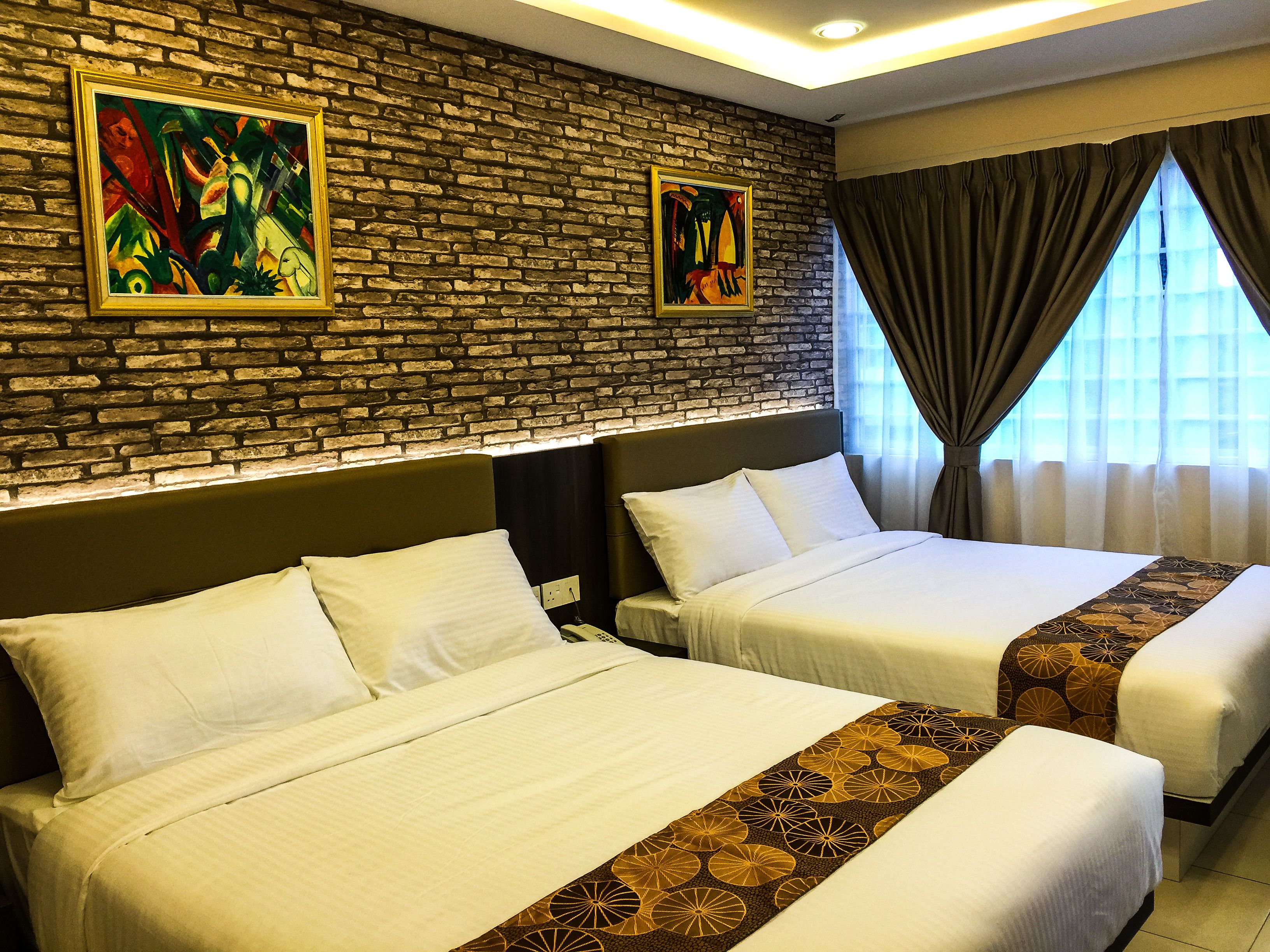 deluxe quadruple room | in-room safe, desk, iron/ironing board, free wifi
