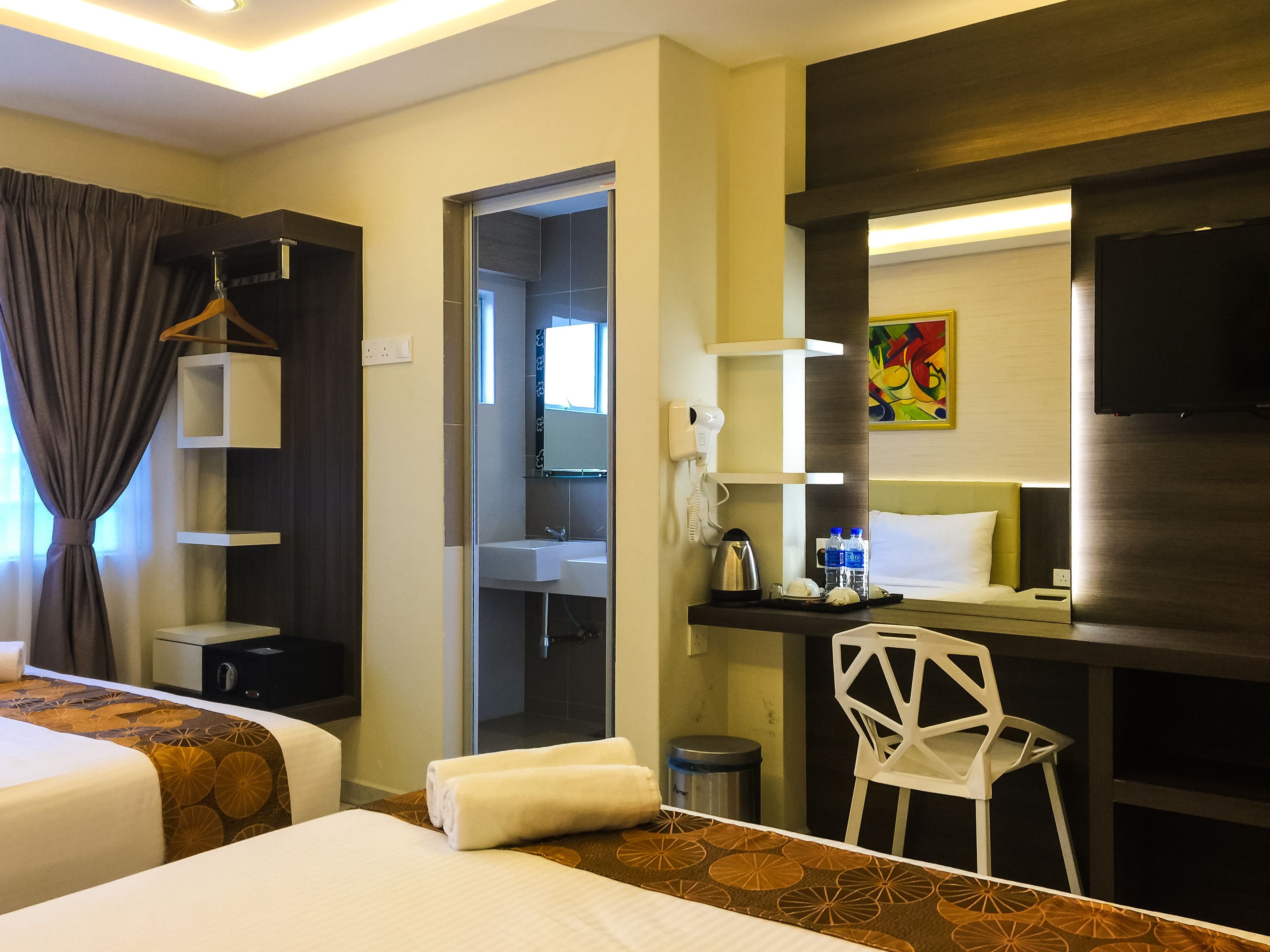 deluxe quadruple room | in-room safe, desk, iron/ironing board, free wifi