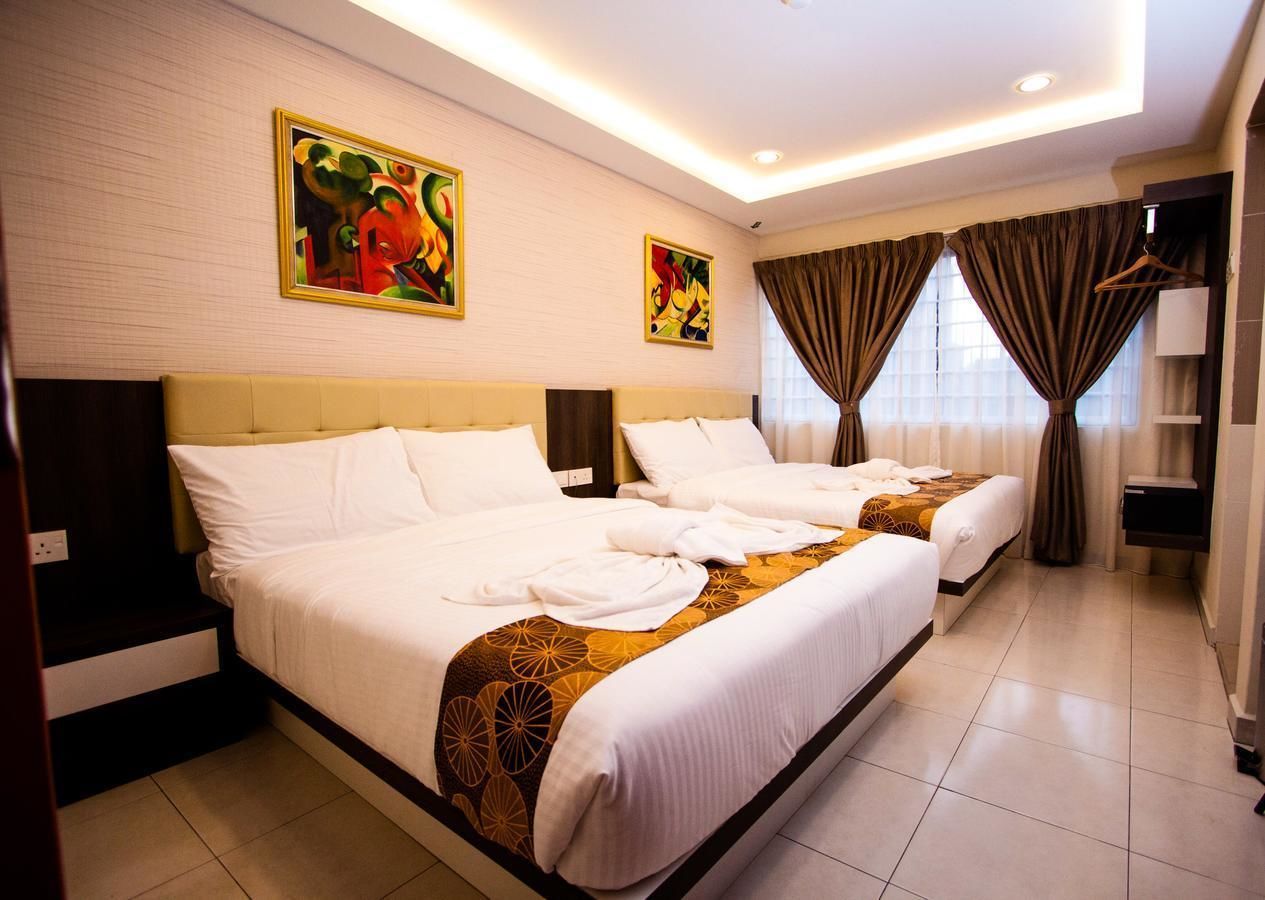 deluxe quadruple room | in-room safe, desk, iron/ironing board, free wifi