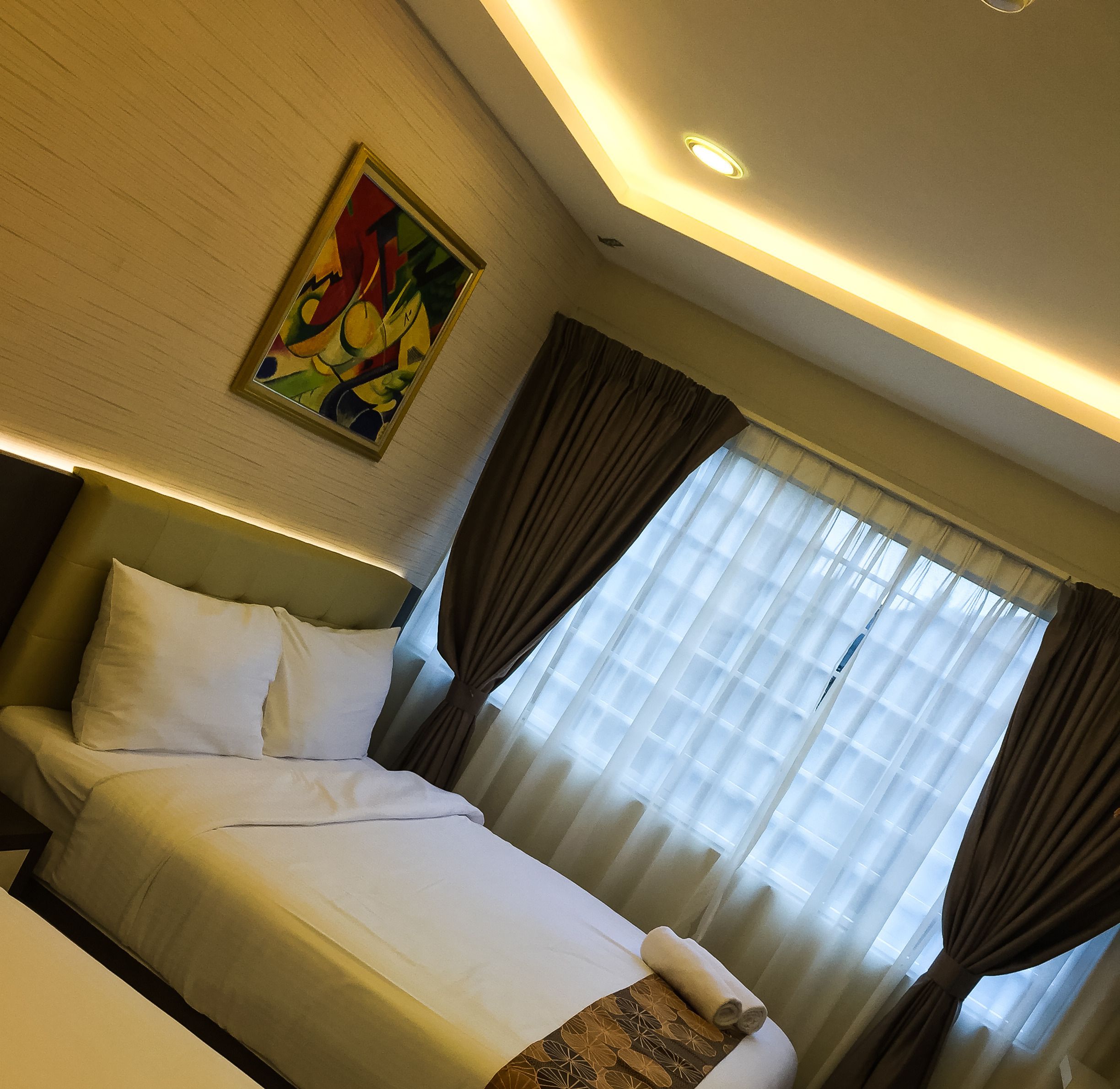 deluxe quadruple room | in-room safe, desk, iron/ironing board, free wifi
