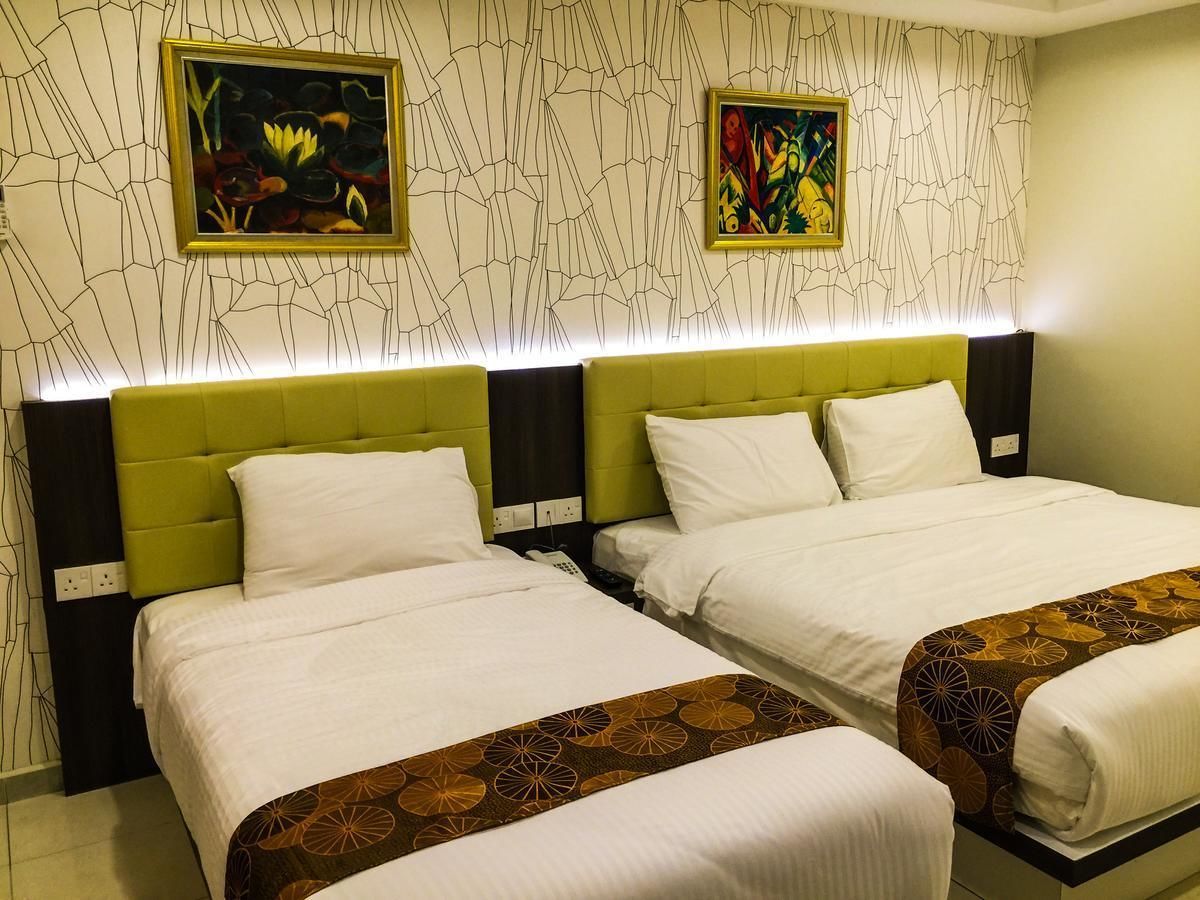 deluxe triple room | in-room safe, desk, iron/ironing board, free wifi