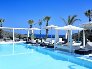 Seasonal outdoor pool, open 7:30 AM to 8:30 PM, free cabanas