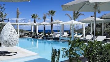 Seasonal outdoor pool, open 7:30 AM to 8:30 PM, free pool cabanas