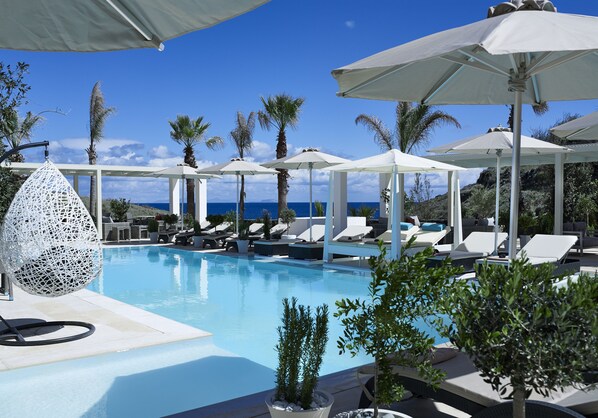 Seasonal outdoor pool, open 7:30 AM to 8:30 PM, free cabanas