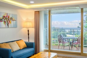 Suite, 2 Bedrooms, Non Smoking, Partial Ocean View | Living area | 30-inch flat-screen TV with cable channels - Jeju M Resort (Seogwipo)