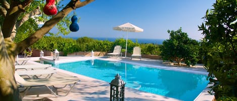 Seasonal outdoor pool, pool umbrellas, pool loungers