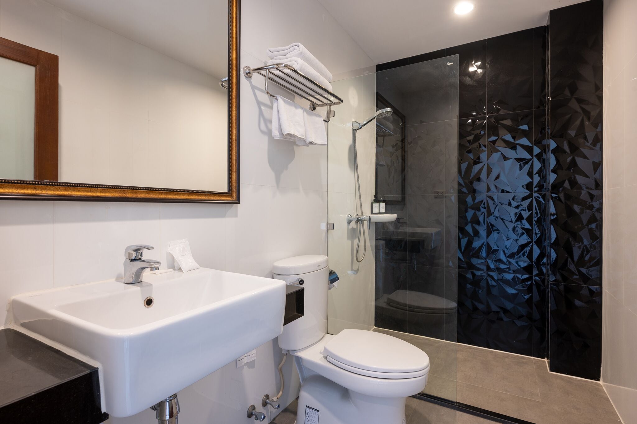 deluxe triple room | bathroom | shower, free toiletries, hair dryer, slippers