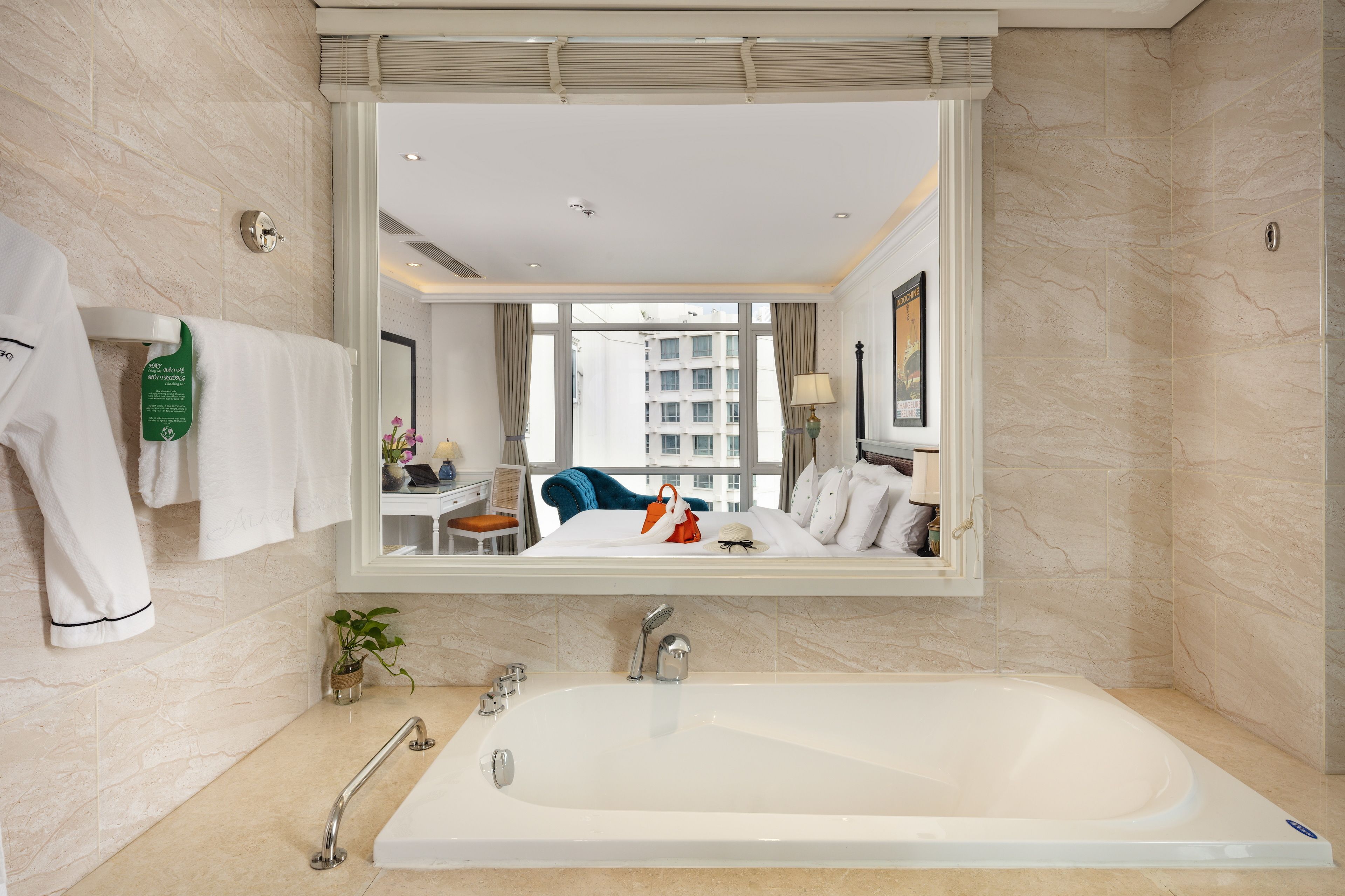 designer toiletries, hair dryer, slippers, towels