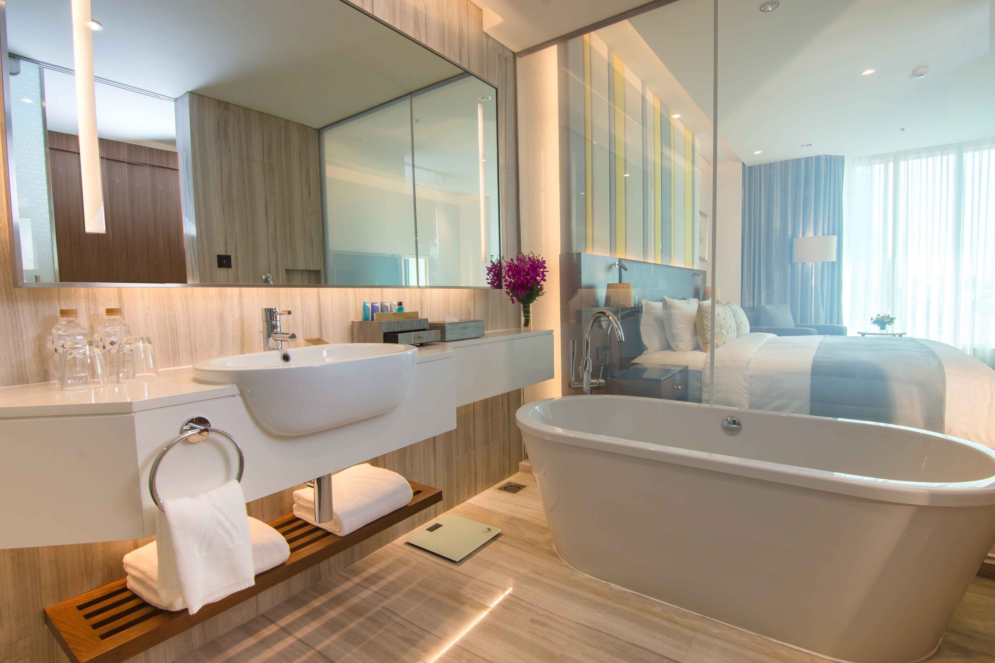 designer toiletries, hair dryer, bathrobes, slippers