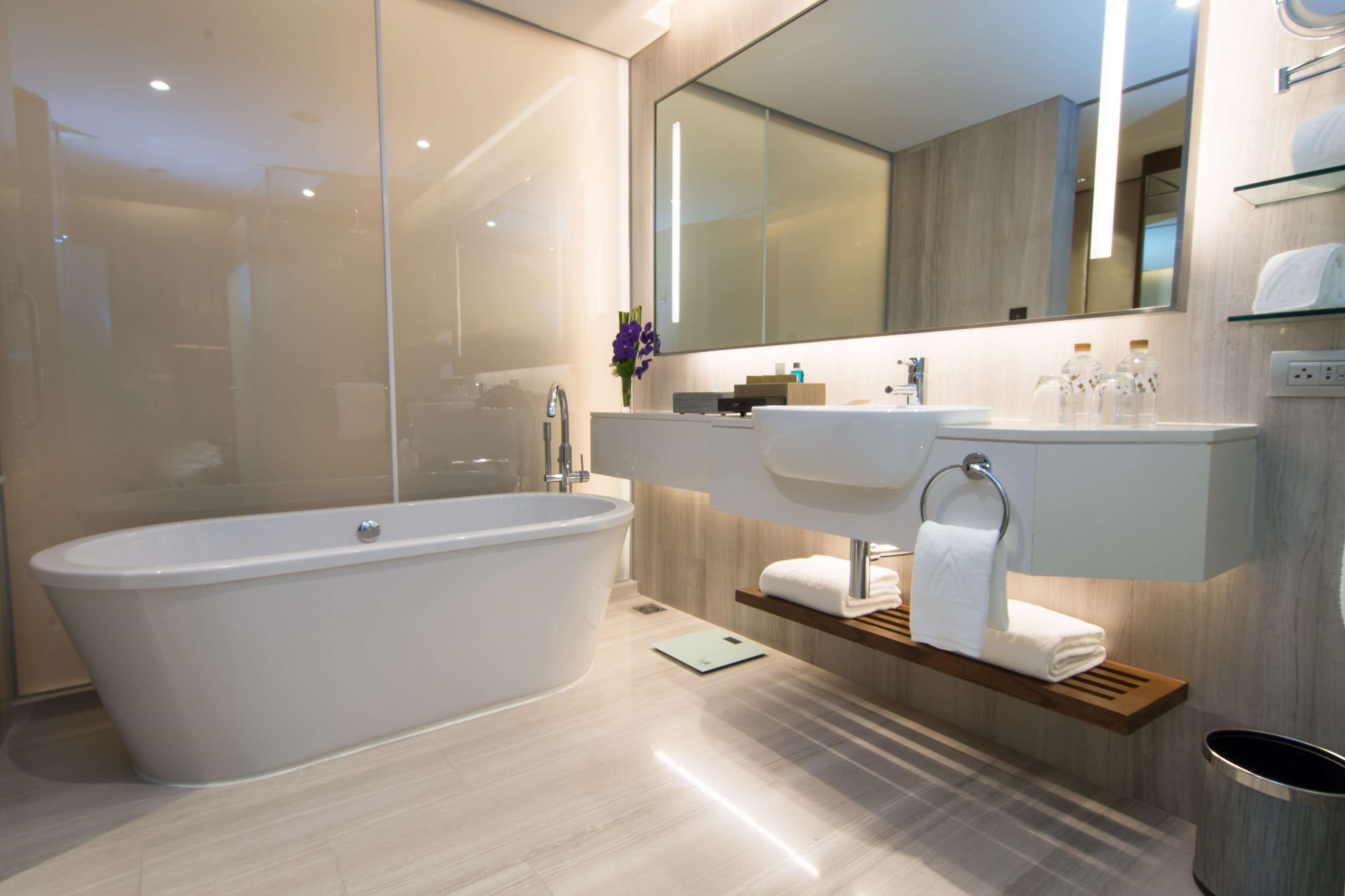 designer toiletries, hair dryer, bathrobes, slippers