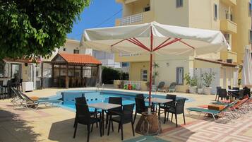 Outdoor pool, pool umbrellas, pool loungers