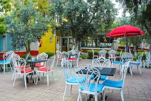 Breakfast, lunch, dinner served; Regional cuisine, garden views 