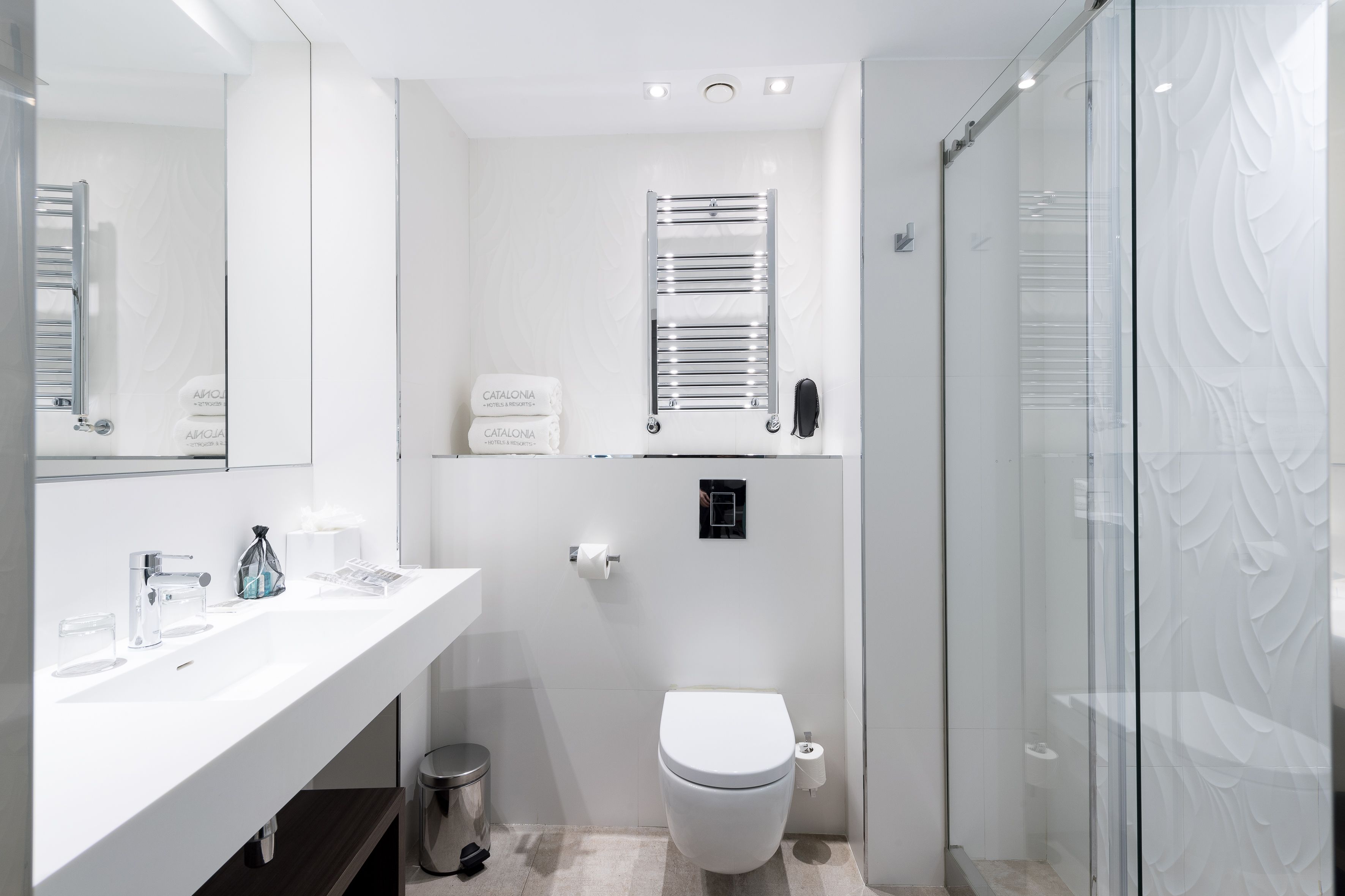 eco-friendly toiletries, hair dryer, towels, soap