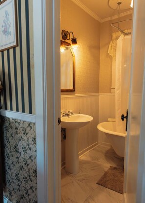 A bathroom with a sink, toilet, and shower. - Julian Gold Rush Hotel (Julian)