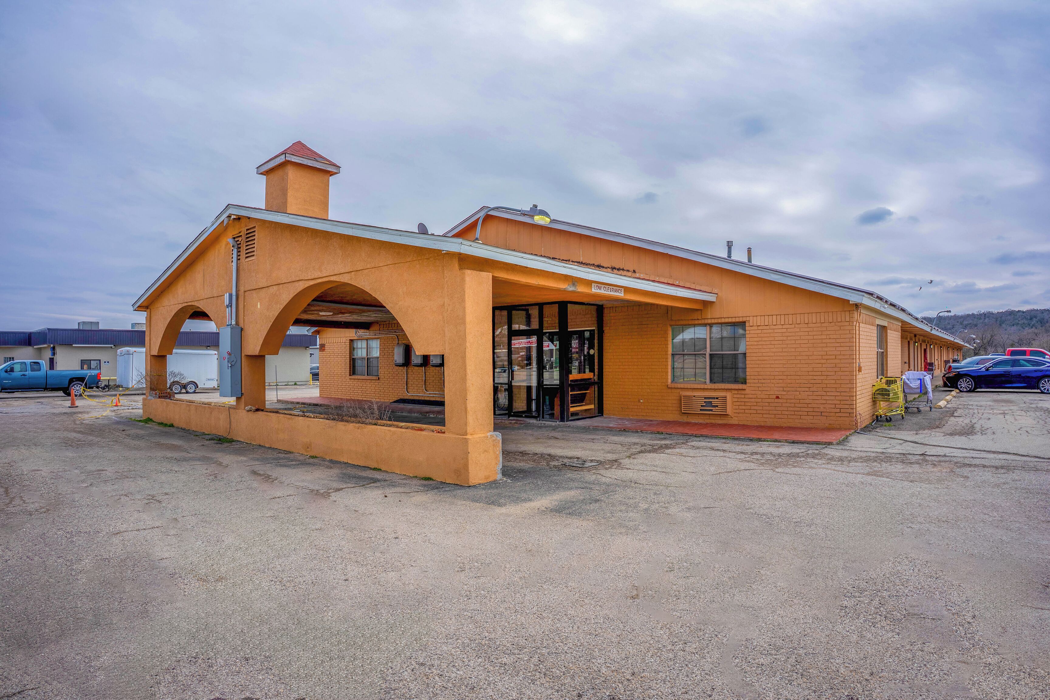 A single-story building with a brick facade and a flat roof.