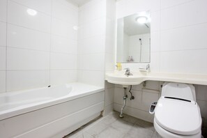 Separate tub and shower, free toiletries, hair dryer, slippers