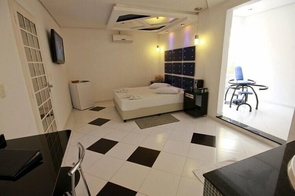 Suite (Hidro e Sauna) | Minibar, individually decorated, individually furnished, blackout drapes