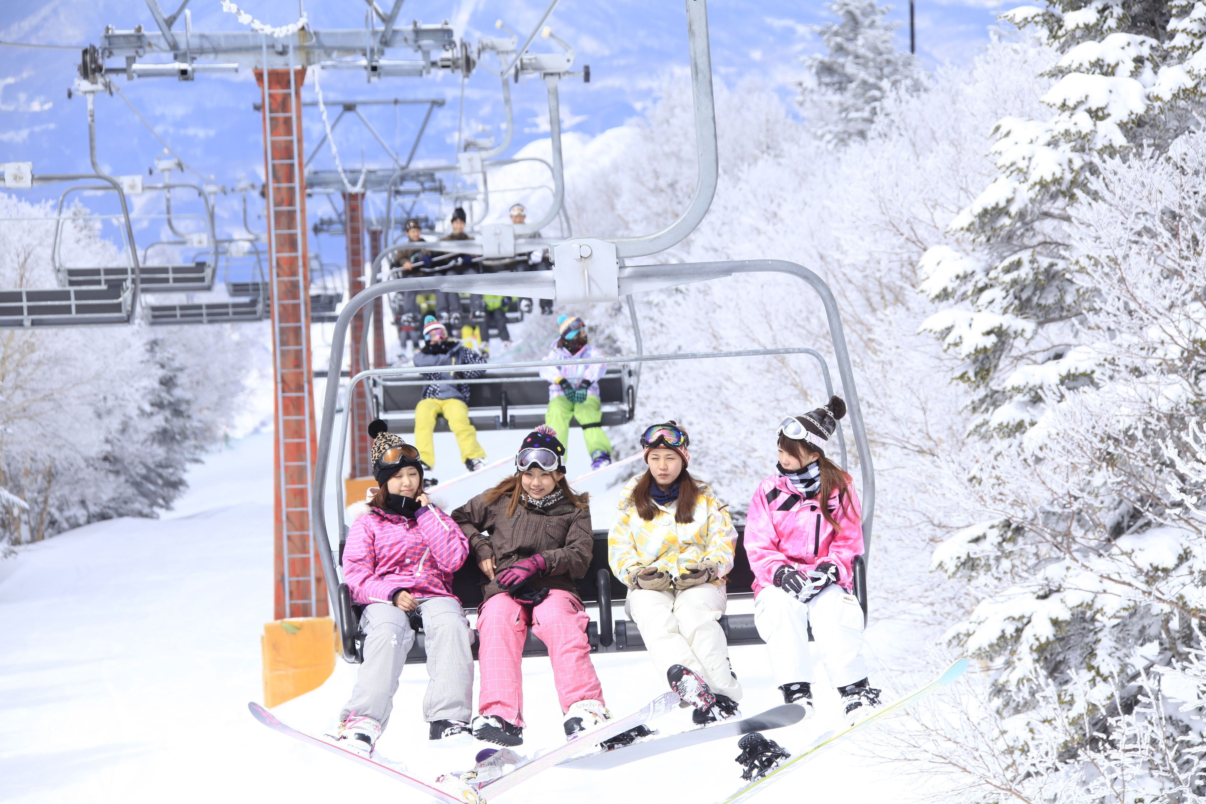 A ski lift with passengers.