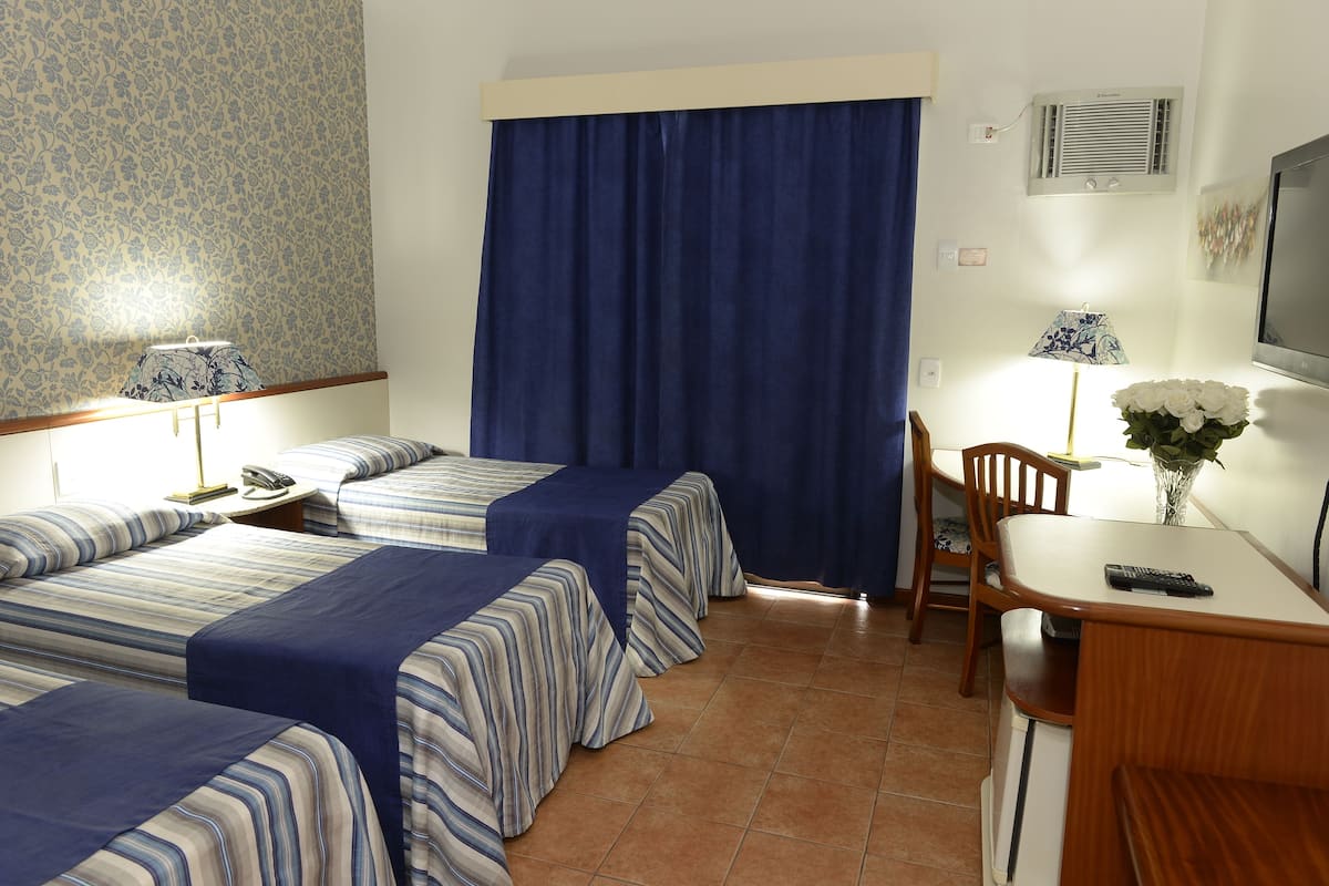 Triple Room | Minibar, desk, blackout drapes, free WiFi