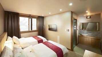 Habitación Deluxe con 2 camas individuales | Cortinas blackout y wifi gratis