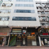 A multi-story building with a storefront labeled "METROPLACE" and a sign for "Vietnam House".