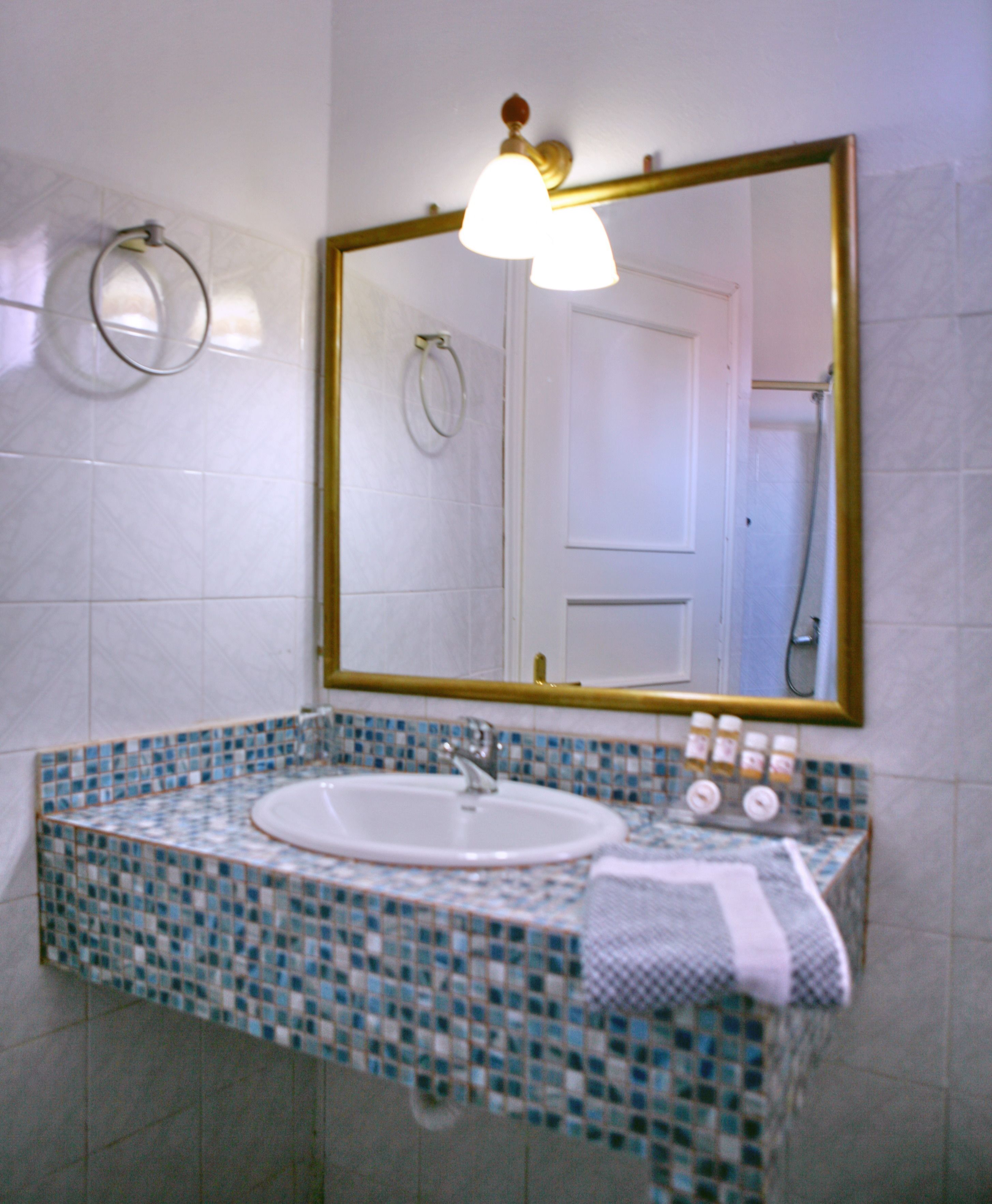 shower, designer toiletries, hair dryer, towels