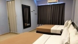 A hotel room with two beds, a mirror, a window with curtains, and an air conditioning unit. - Hotel Jelai Mentakab (Mentakab)