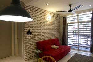 Signature Apartment, 3 Bedrooms, Balcony, Ground Floor (3PM Check-In) | Living room | 50-inch flat-screen TV with digital channels, TV