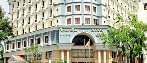 A hotel with a prominent sign reading "HOTEL" and "Ninh Kieu 2".