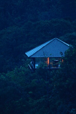A traditional Japanese-style house nestled among dense forest. - The IBNII Spa Resort (Madikeri)