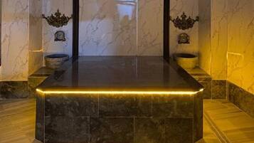 Experience the sleek, modern design of this stylish room, featuring a large platform and elegant crest above.