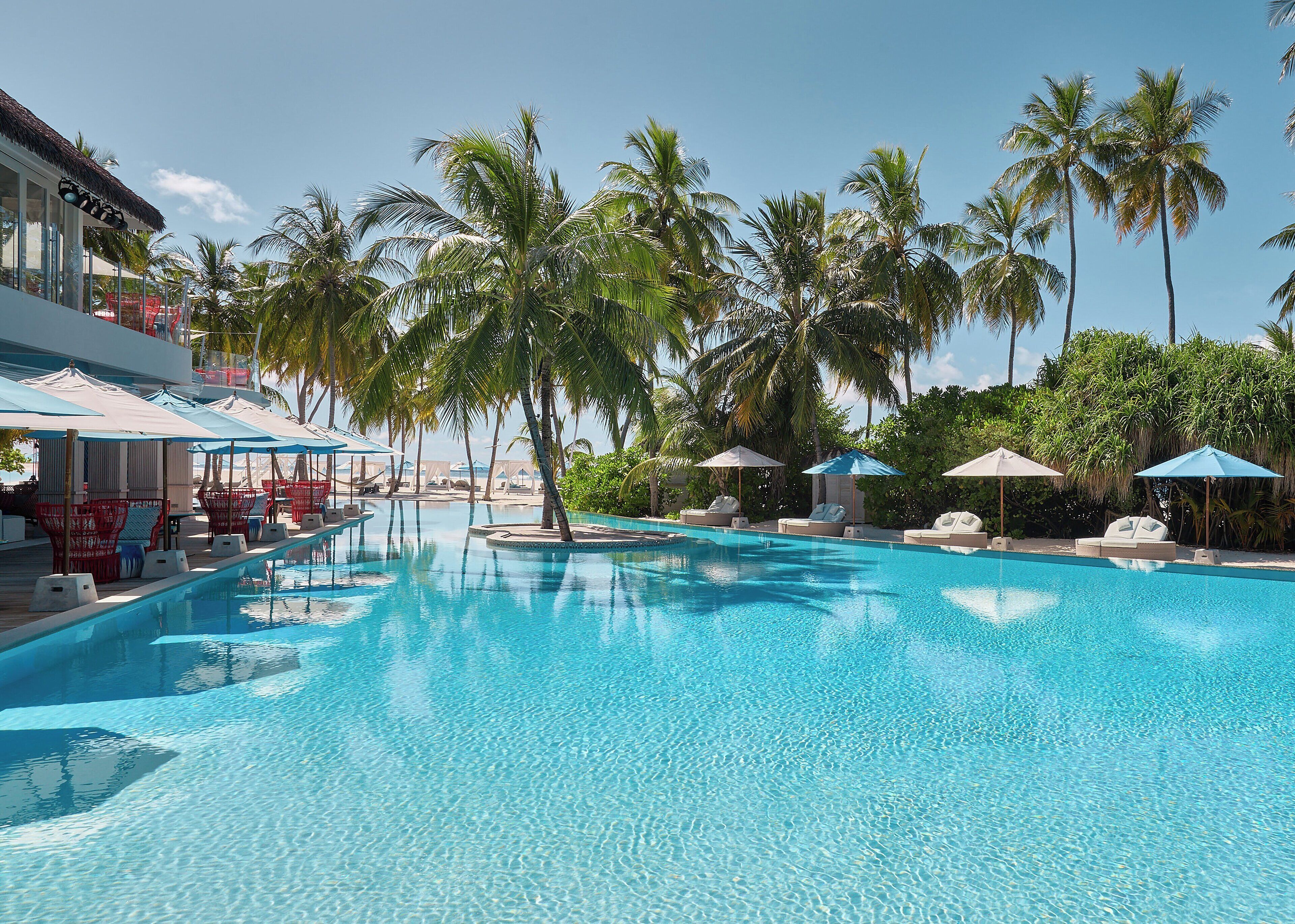 On the beach, white sand, free beach cabanas, sun loungers