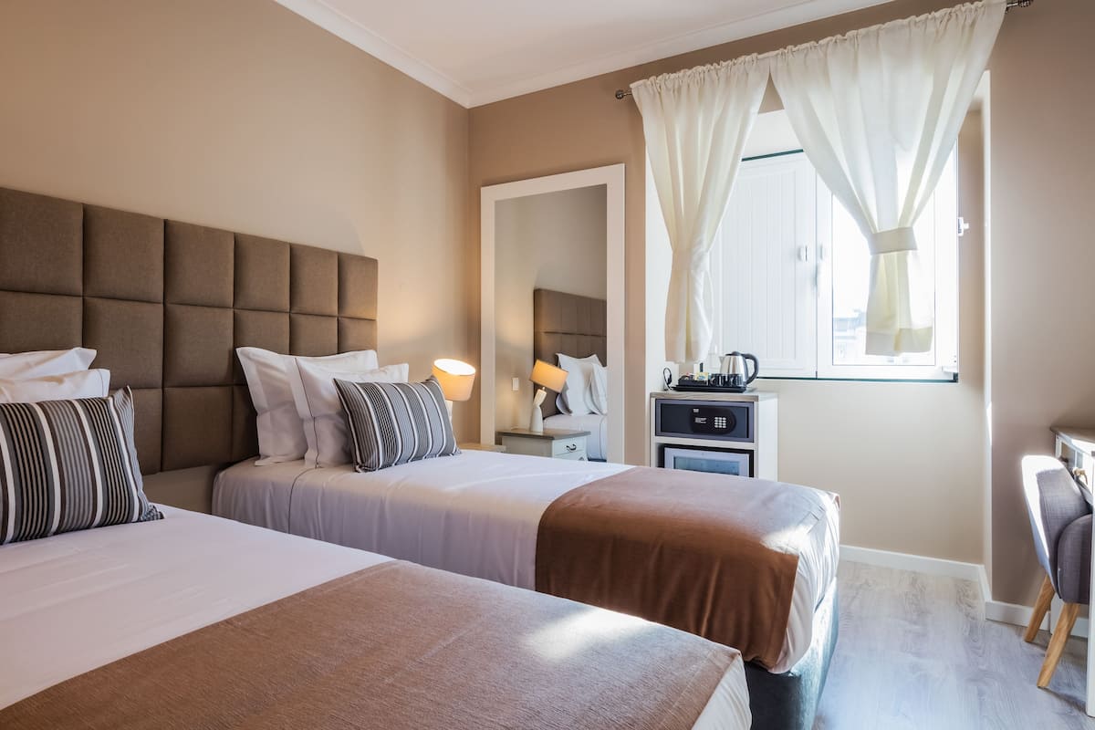 Standard Twin Room, Private Bathroom | In-room safe, desk, blackout drapes, soundproofing