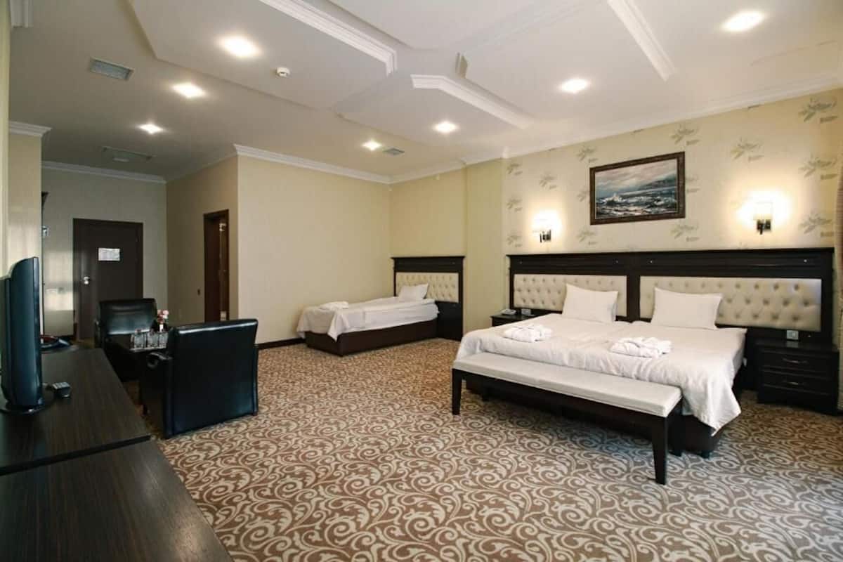 Standard Triple Room | Minibar, in-room safe, desk, soundproofing
