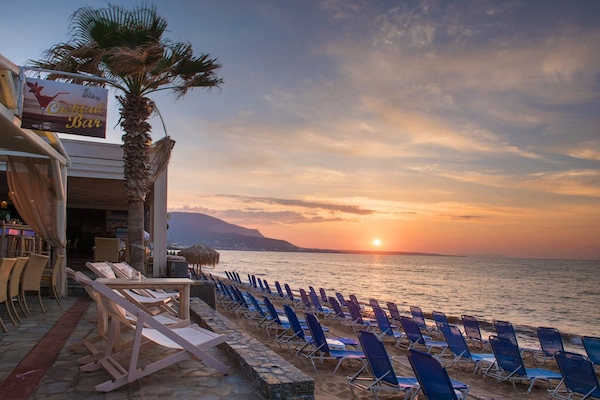 On the beach, sun loungers, beach umbrellas