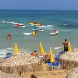 On the beach, sun-loungers, beach umbrellas